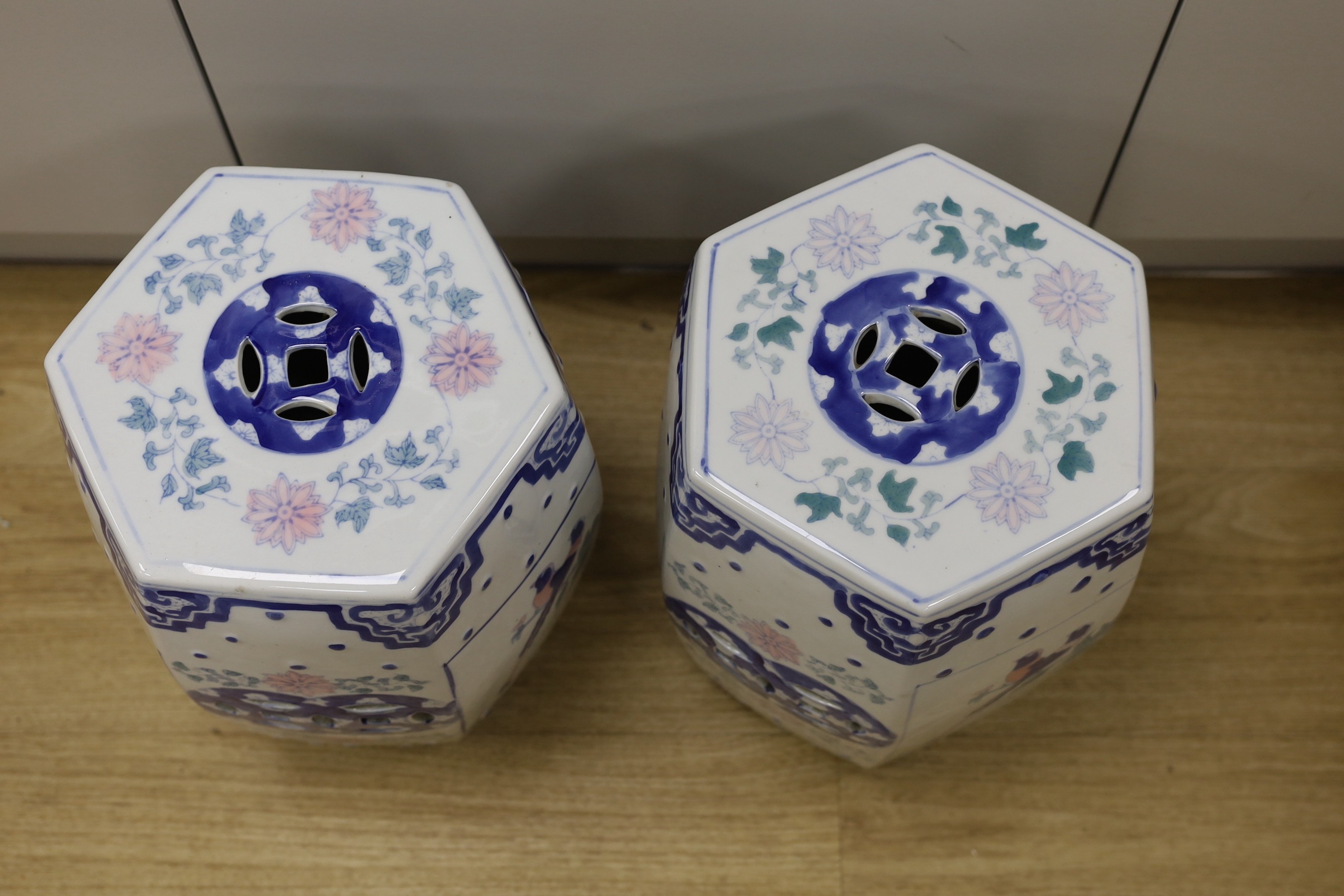 A pair of Chinese porcelain decorative garden seats, 37cms high